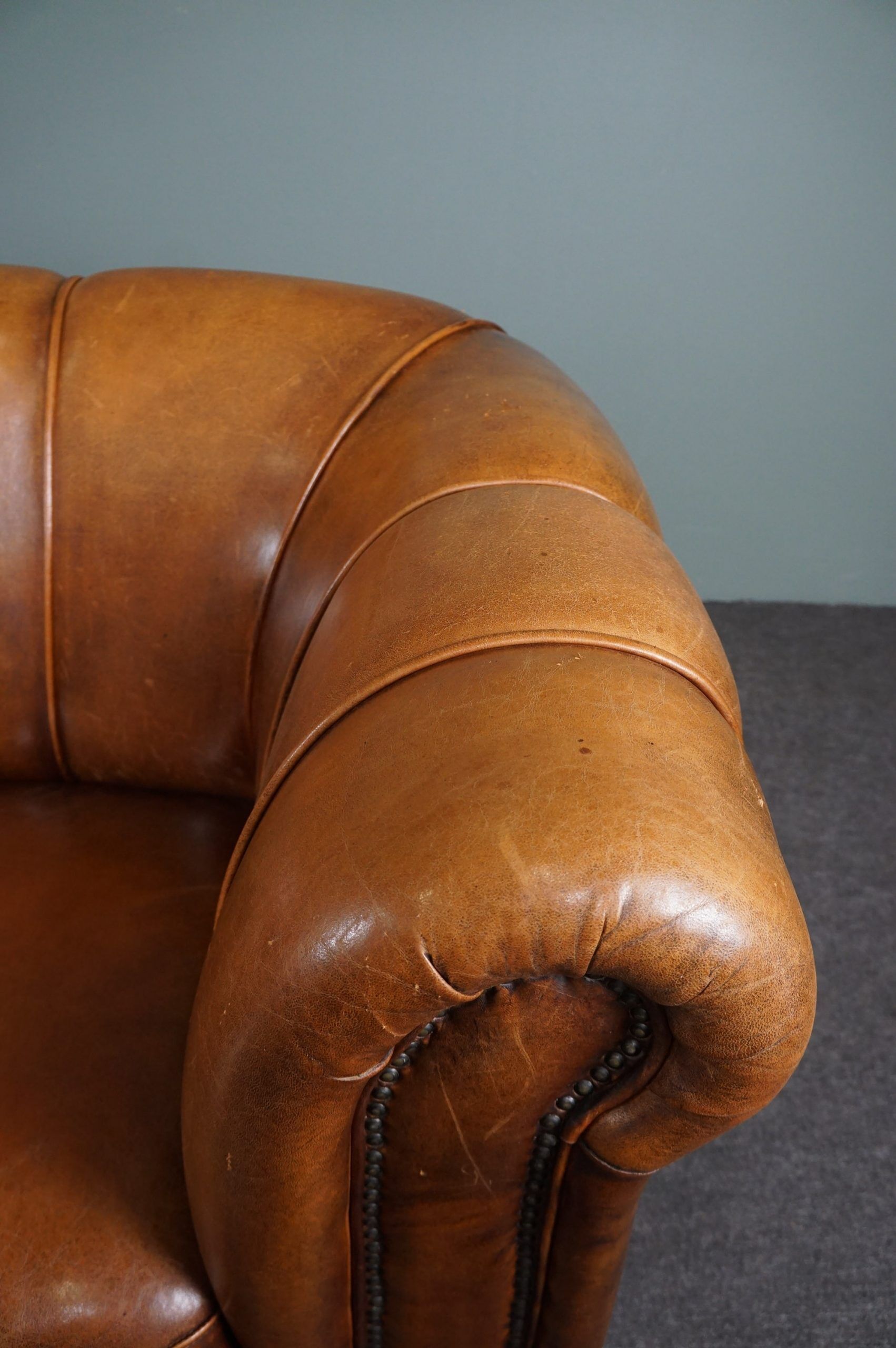 Sheepskin sofa with decorative nails