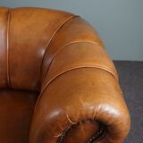 Sheepskin sofa with decorative nails