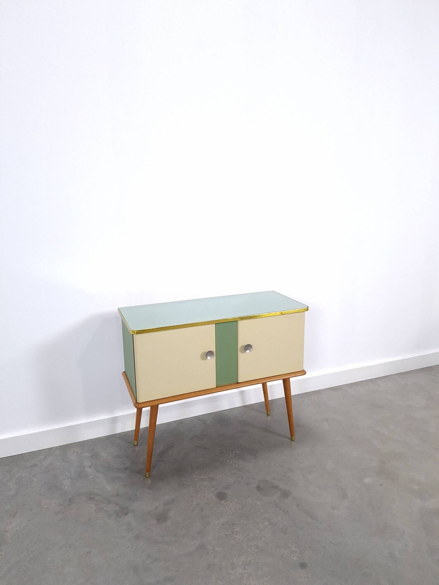 Vintage green DDR cabinet, model Libelle with glass top, slanted legs.