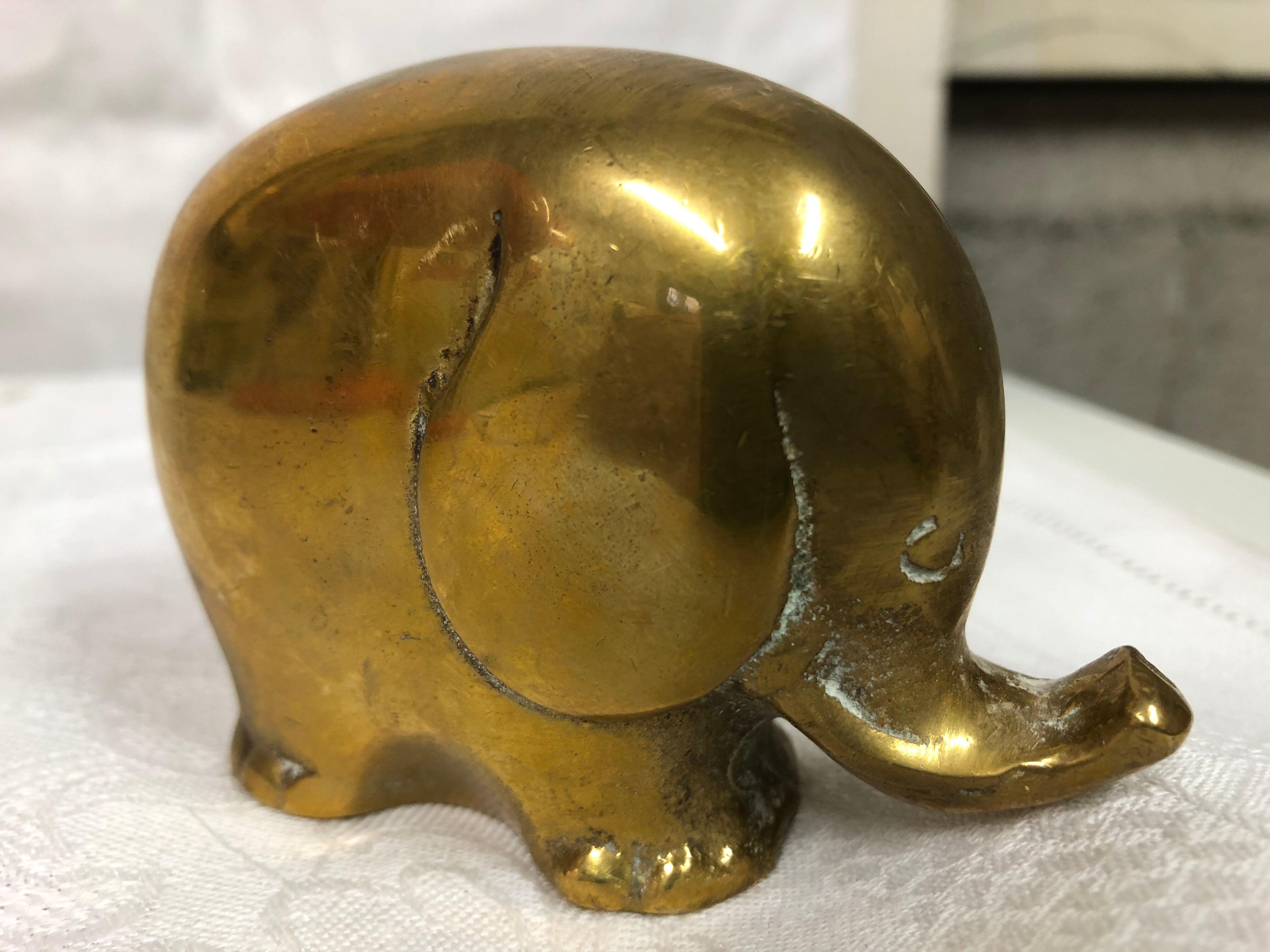 70s golden brass elephant paper press