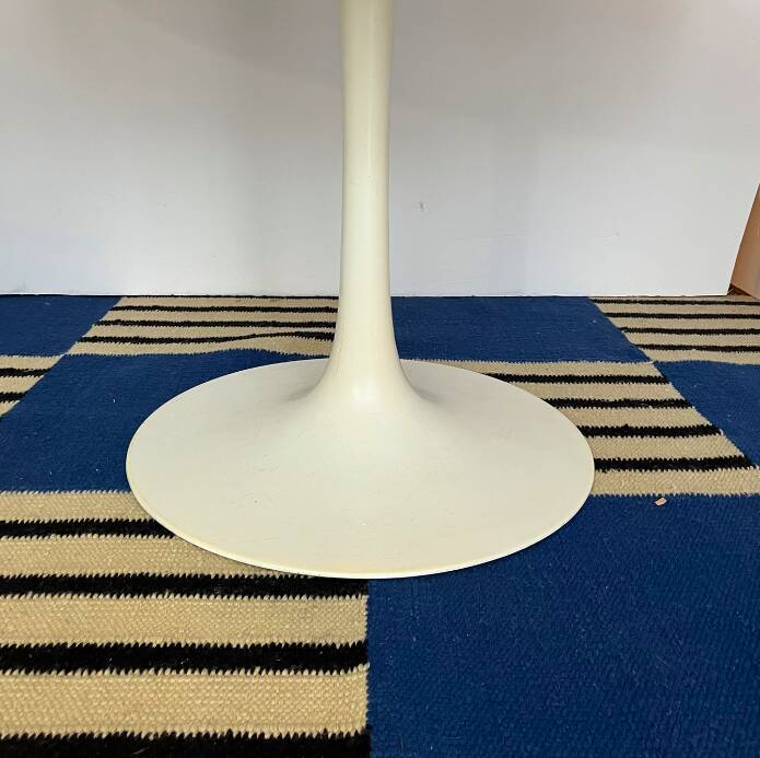 White dining table with tulip base by Maurice Burke