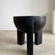 Black mango wood tripod side table with a semi-spherical top, height: 45 cm, diameter: 44 cm.