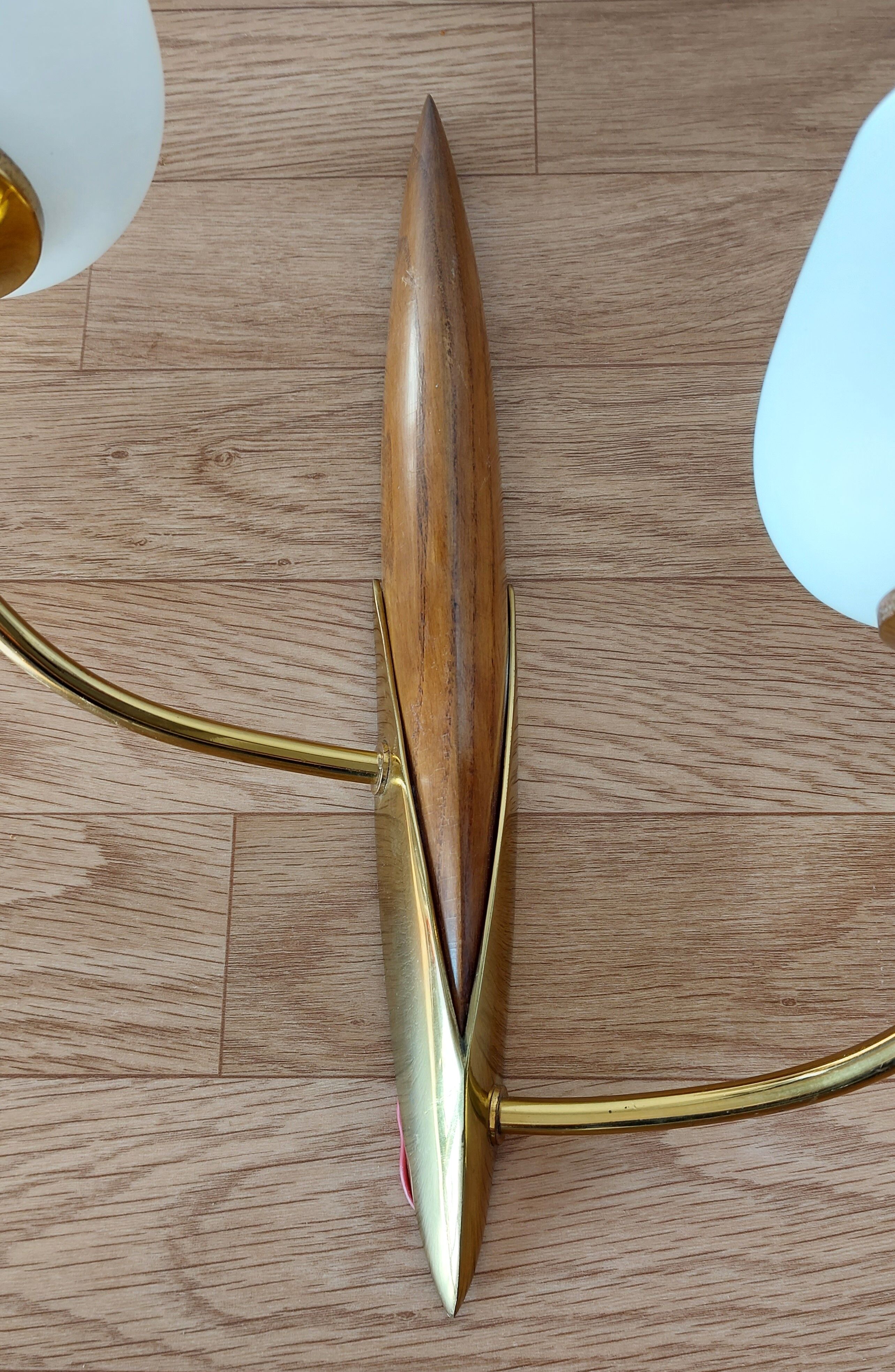 Pair of wood and gilded brass sconces 1950 boat hulls with 2 lights.