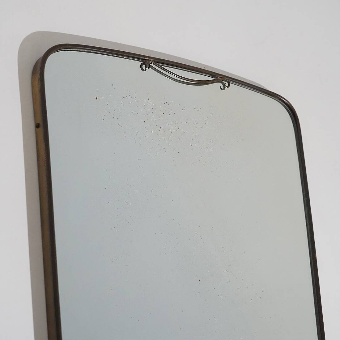 Wall mirror with brass frame, 1950s