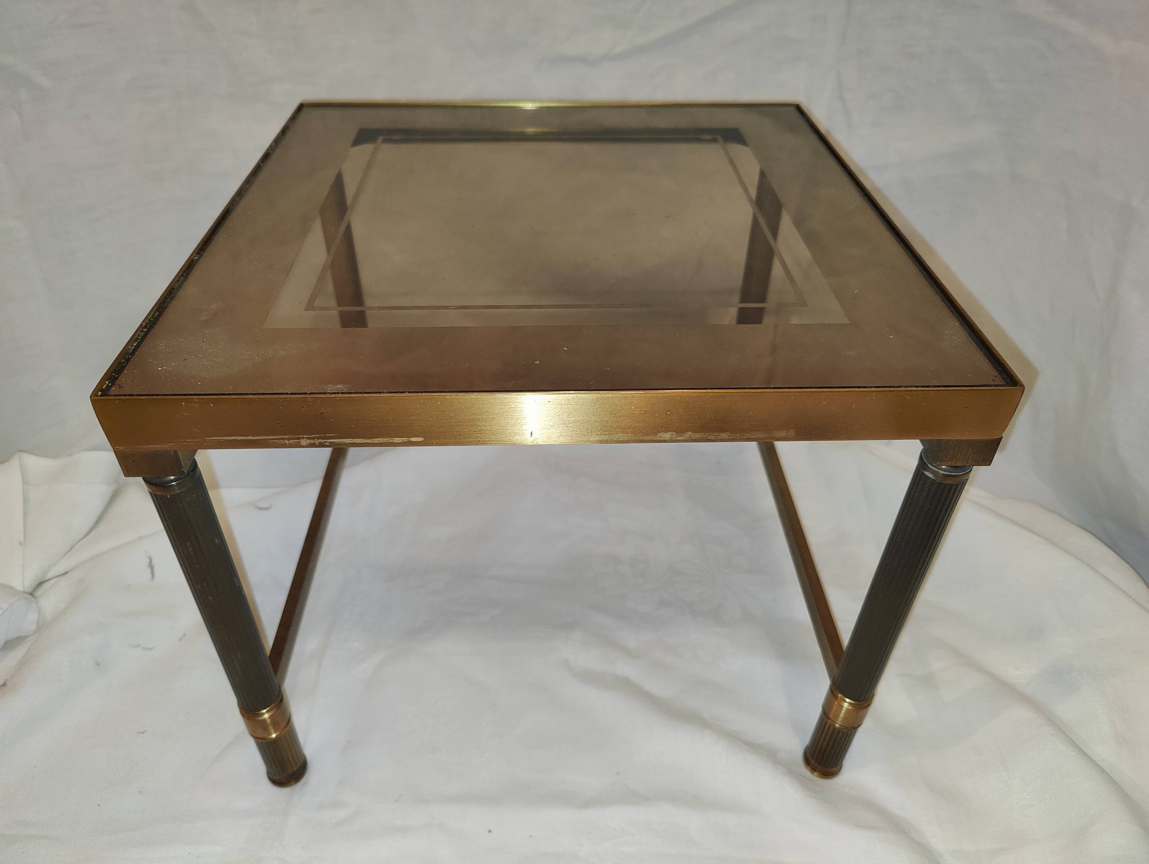 Small table or side table with brass structure and glass top from the 1970s.