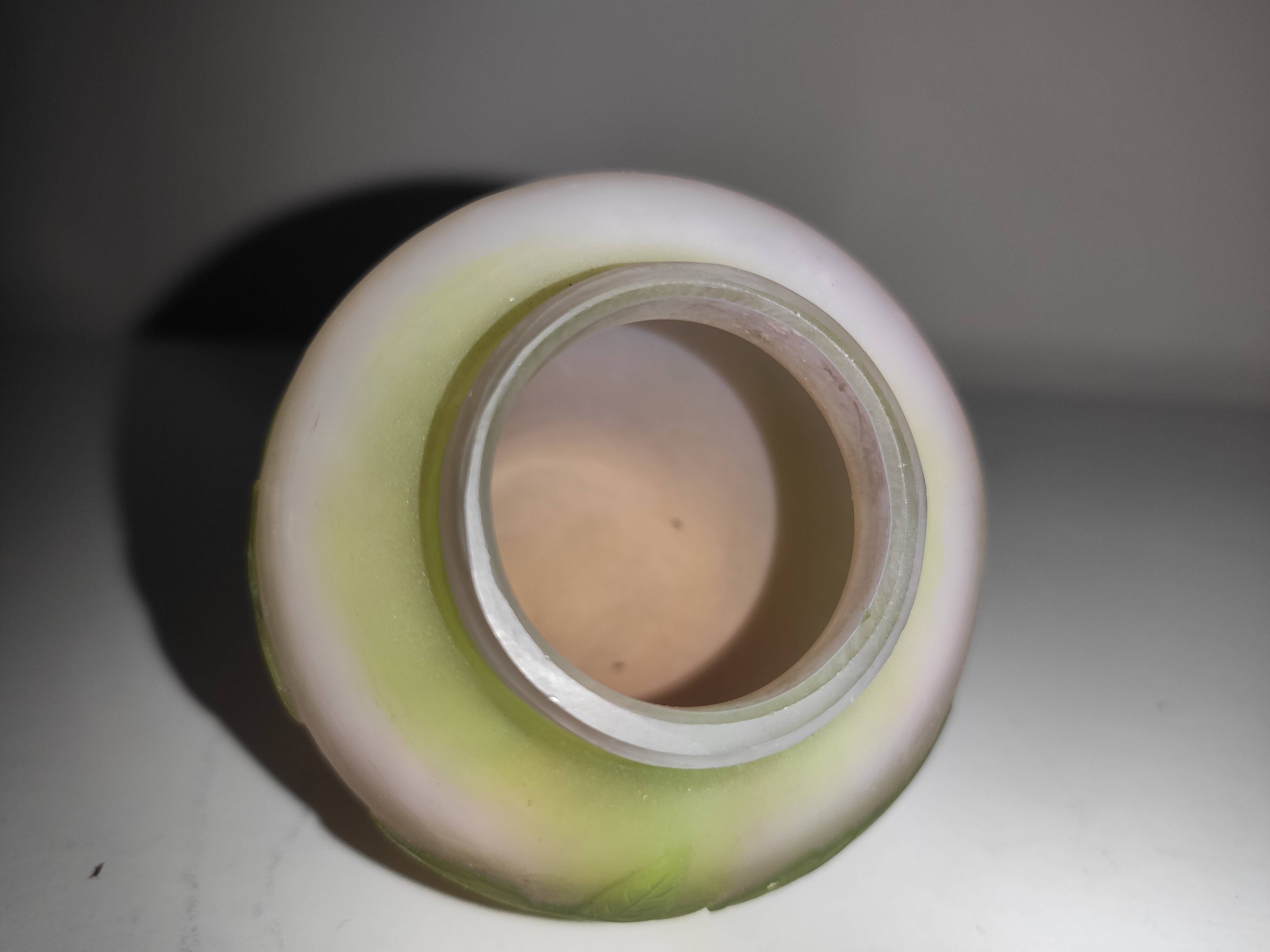 Small E. Gallé vase, "star" signature, light green tone on white background.