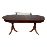 Empire style dining table with two sliding elements.