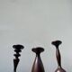 Trio of large turned wooden candlesticks