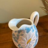 pitcher of daisies