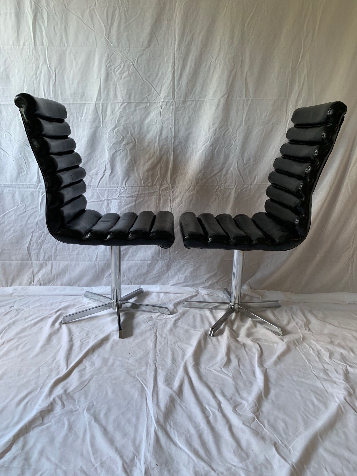 A set of four leather chairs, Italy, 80s