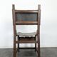Set of 8 Gothic-style chairs in oak and studded leather.