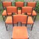 Series of 6 vintage chairs in orange fabric and black lace-up.