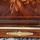 Elegant Napoleon III style commode with fine marquetry, gilded bronze mounts, and a marble top.