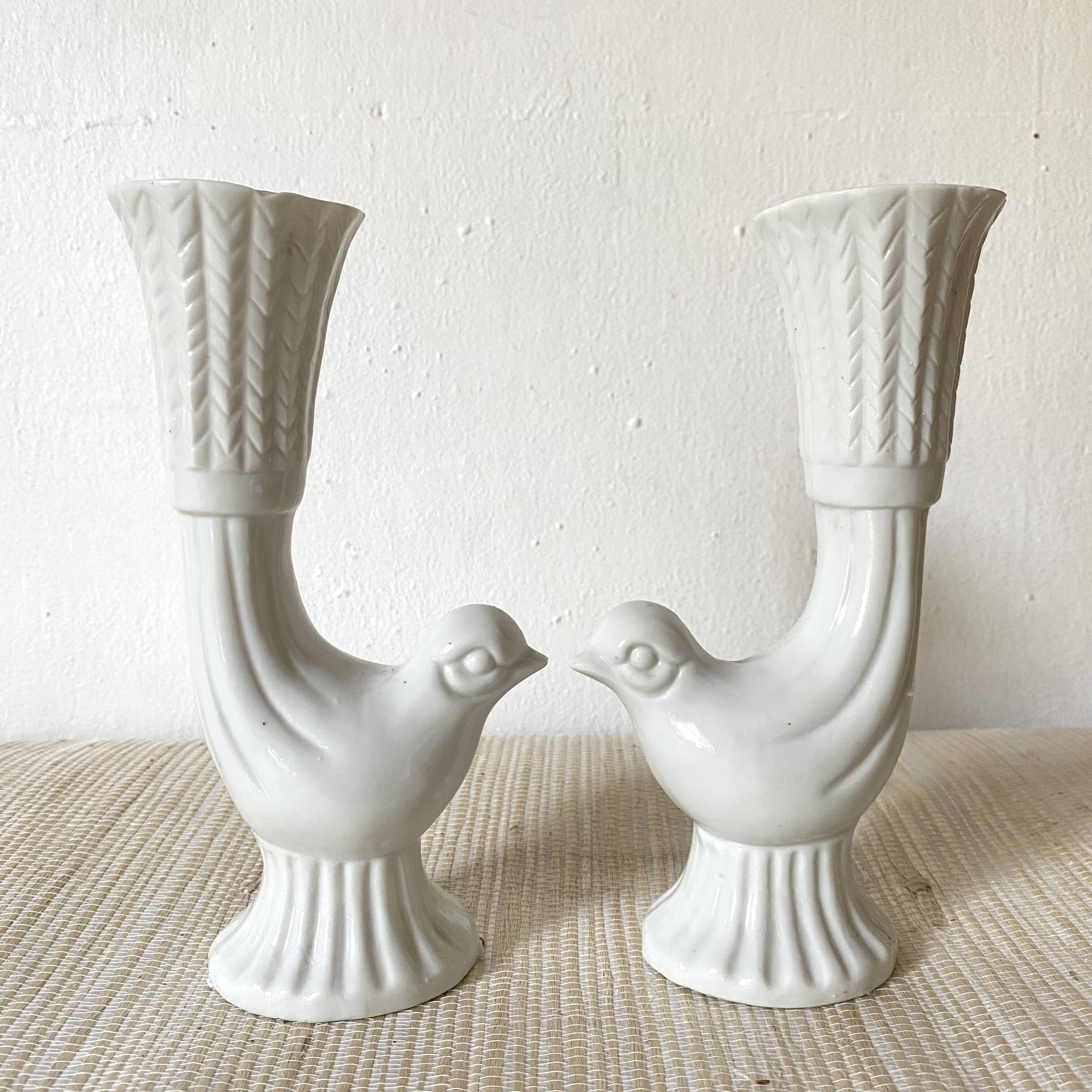 Pair of porcelain candle holders and bird vases