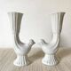 Pair of porcelain candle holders and bird vases