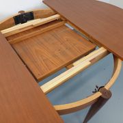 Round dining table in vintage Scandinavian style from the 50s and 60s in teak.