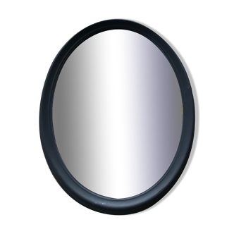 Old wooden oval mirror