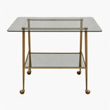 Vintage 1970s glass and gold rolling console table.