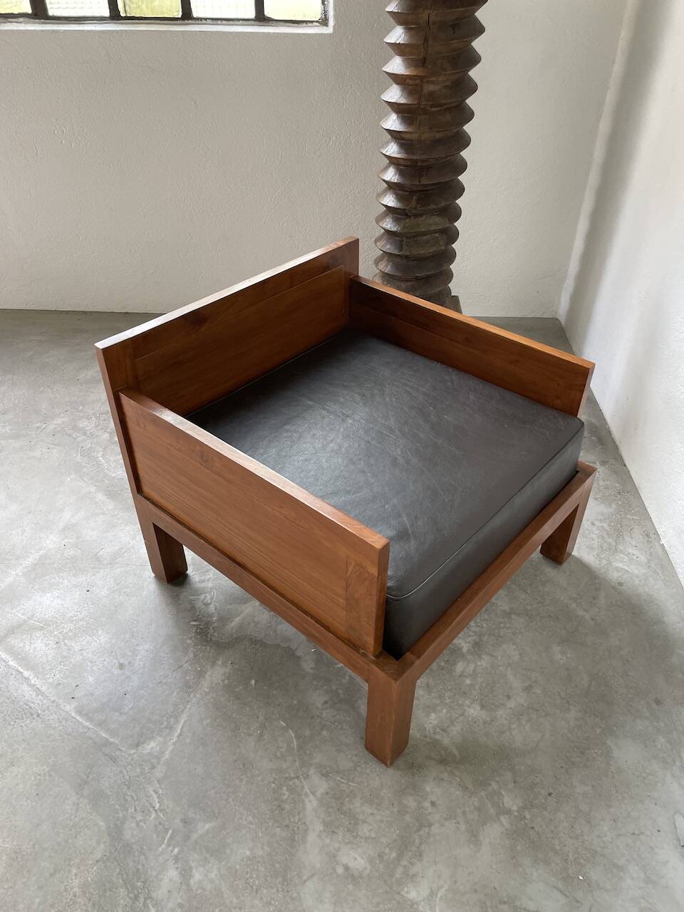 Modernist armchair in exotic wood and leather