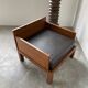 Modernist armchair in exotic wood and leather