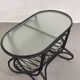 Black rattan and glass coffee table