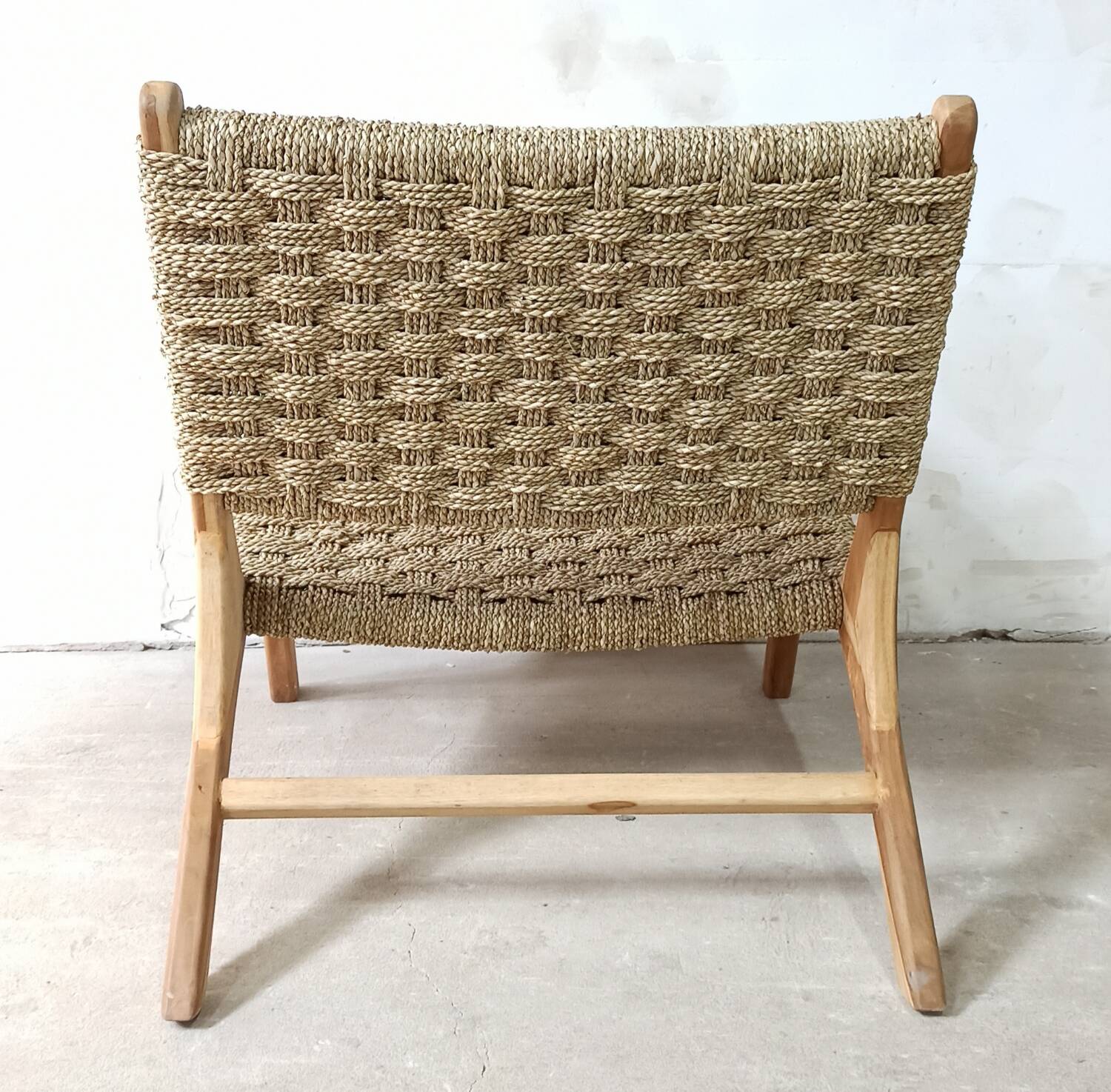 Pair of low armchairs in wood and woven rattan