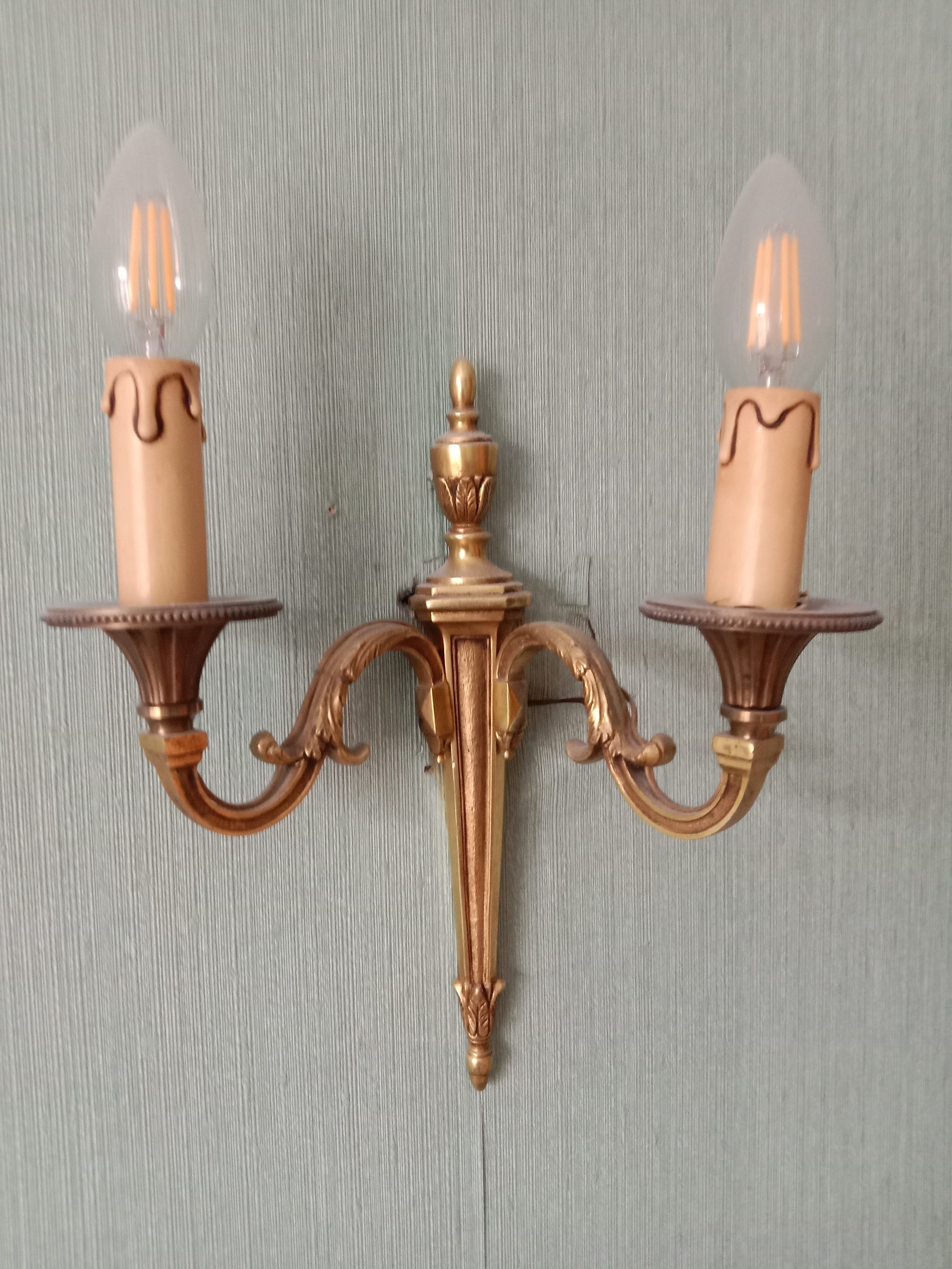 The pair of bronze wall lamps empire style 2 fires