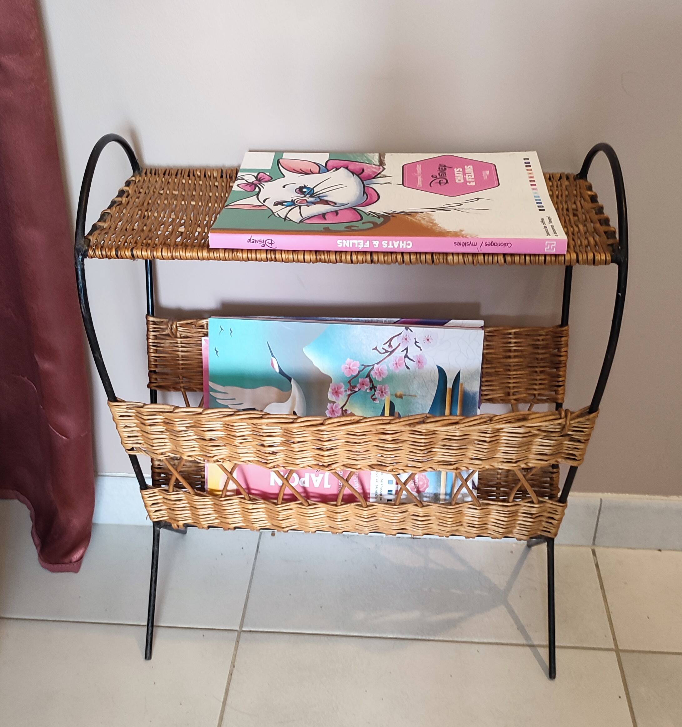 Antique magazine rack made of iron and woven rattan wicker