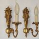 Pair of simple vintage French wall sconces in Art Nouveau bronze with leaf-shaped details.
