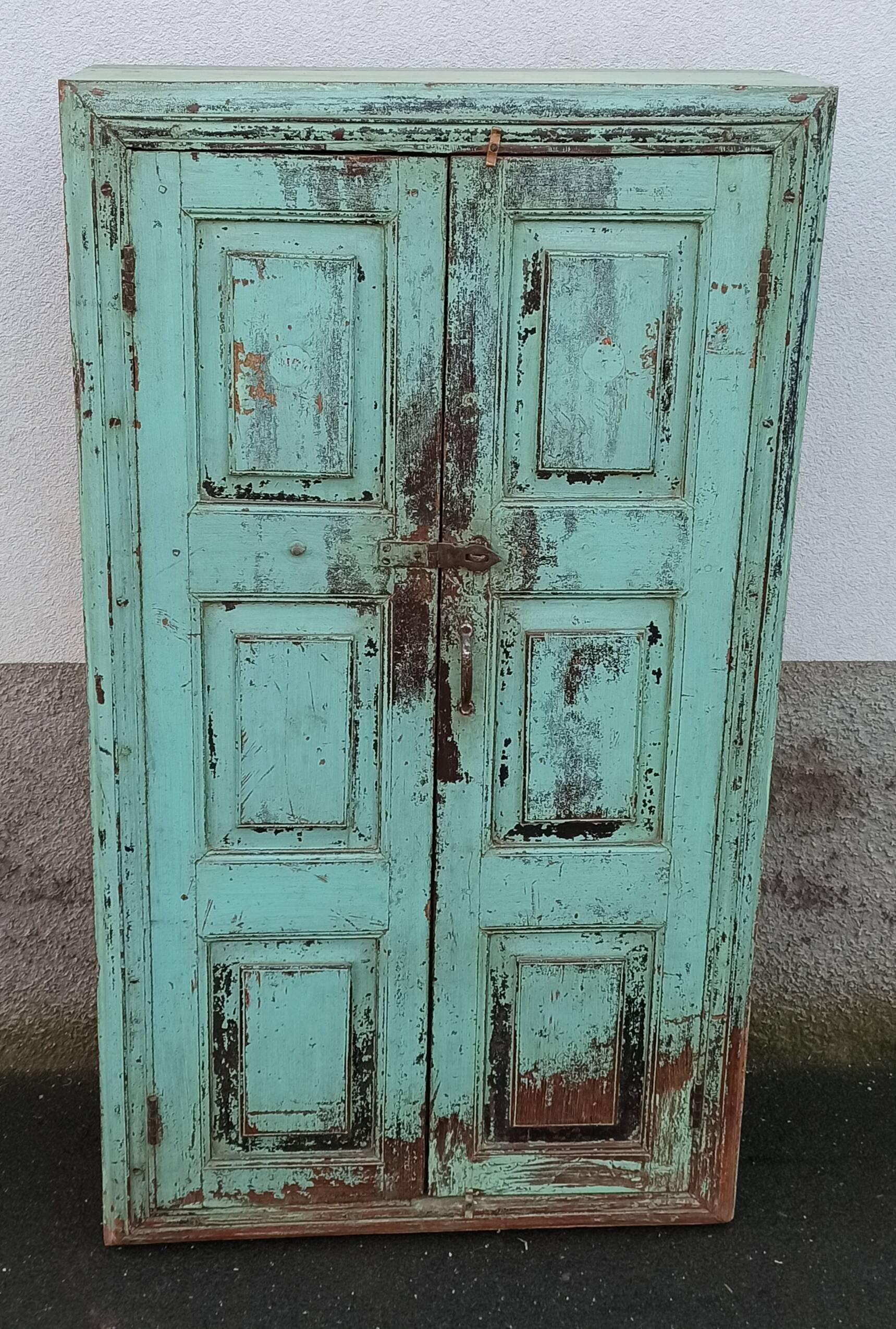 Old wooden cabinet with beautiful green patina