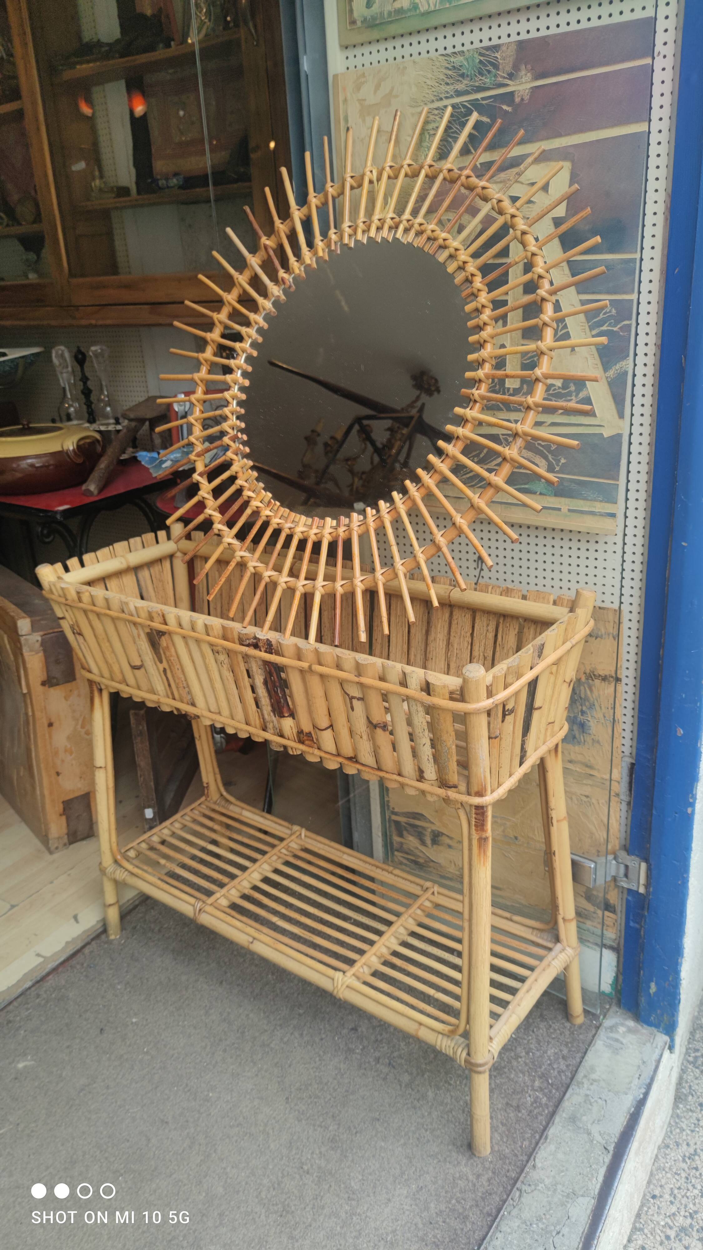 Rattan sunburst mirror, circa 1960, 72 cm in diameter