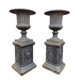 Large antique cast iron vases on pedestal