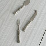 Antique shiny metal cheese cutlery