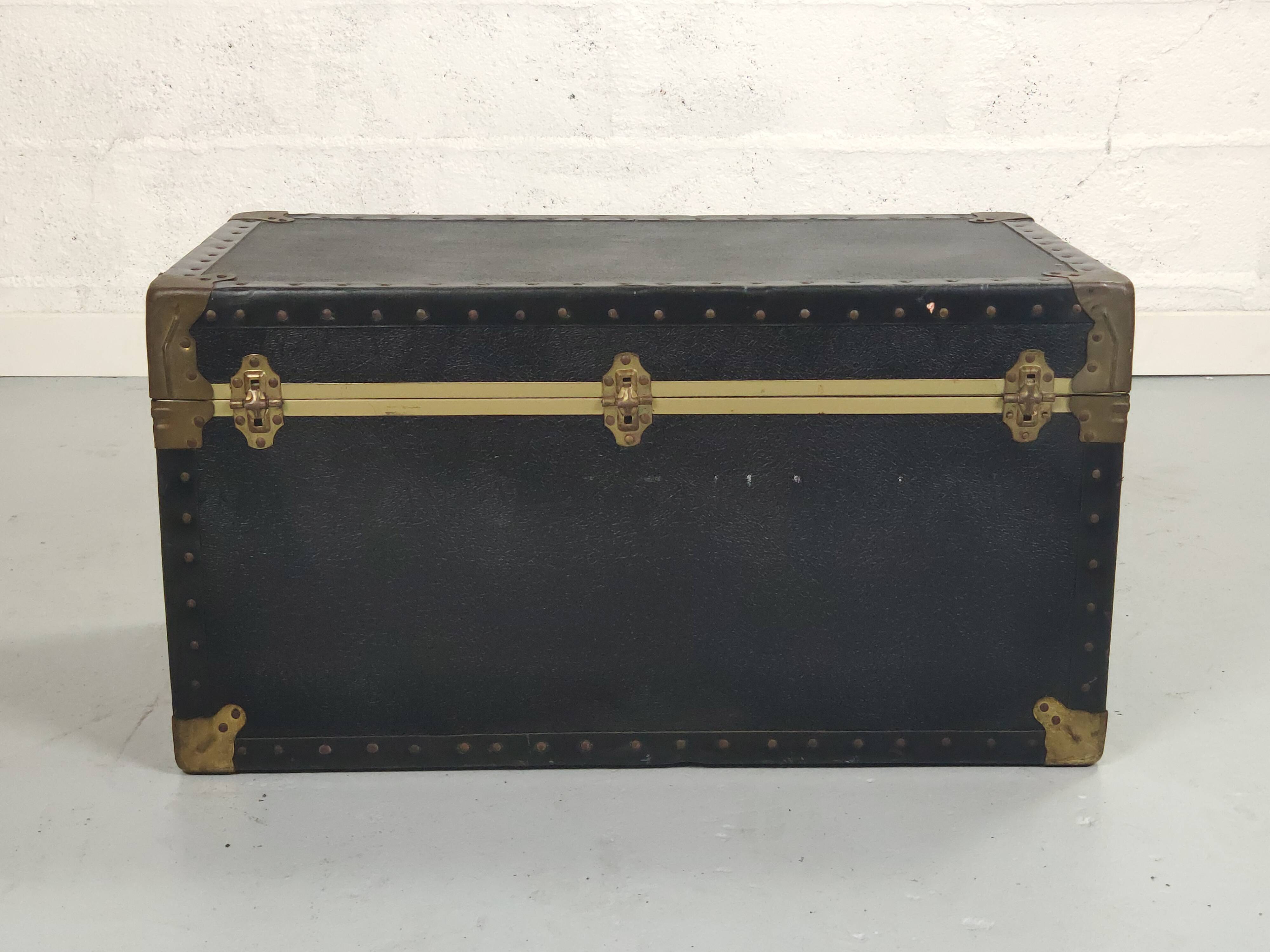 Old black trunk and brass