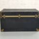 Old black trunk and brass