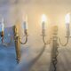 Louis XVI bronze wall sconces from the 19th century with quiver decorations.