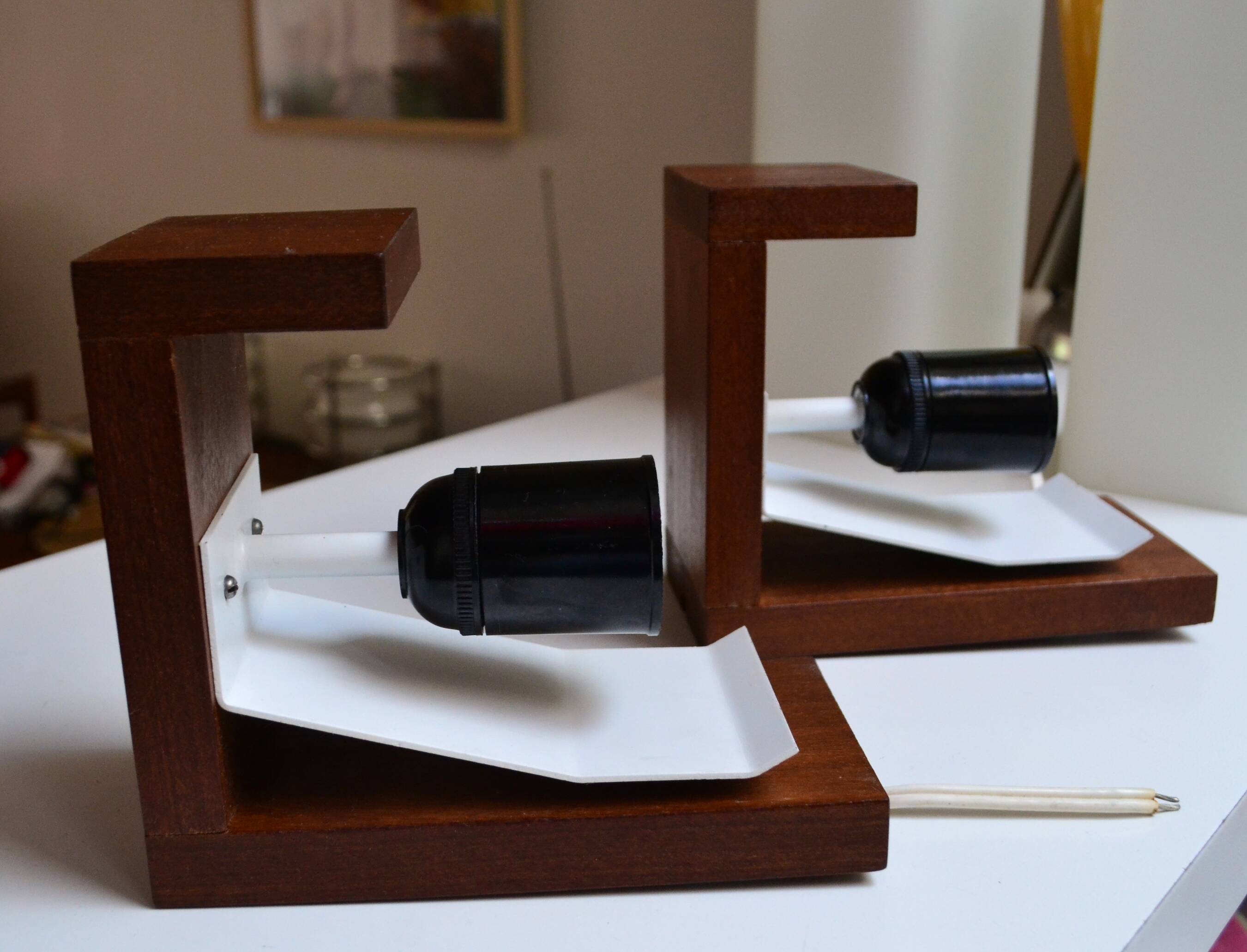 Pair of Louis Kalff wall lights, teak opalines from the 50s/60s.