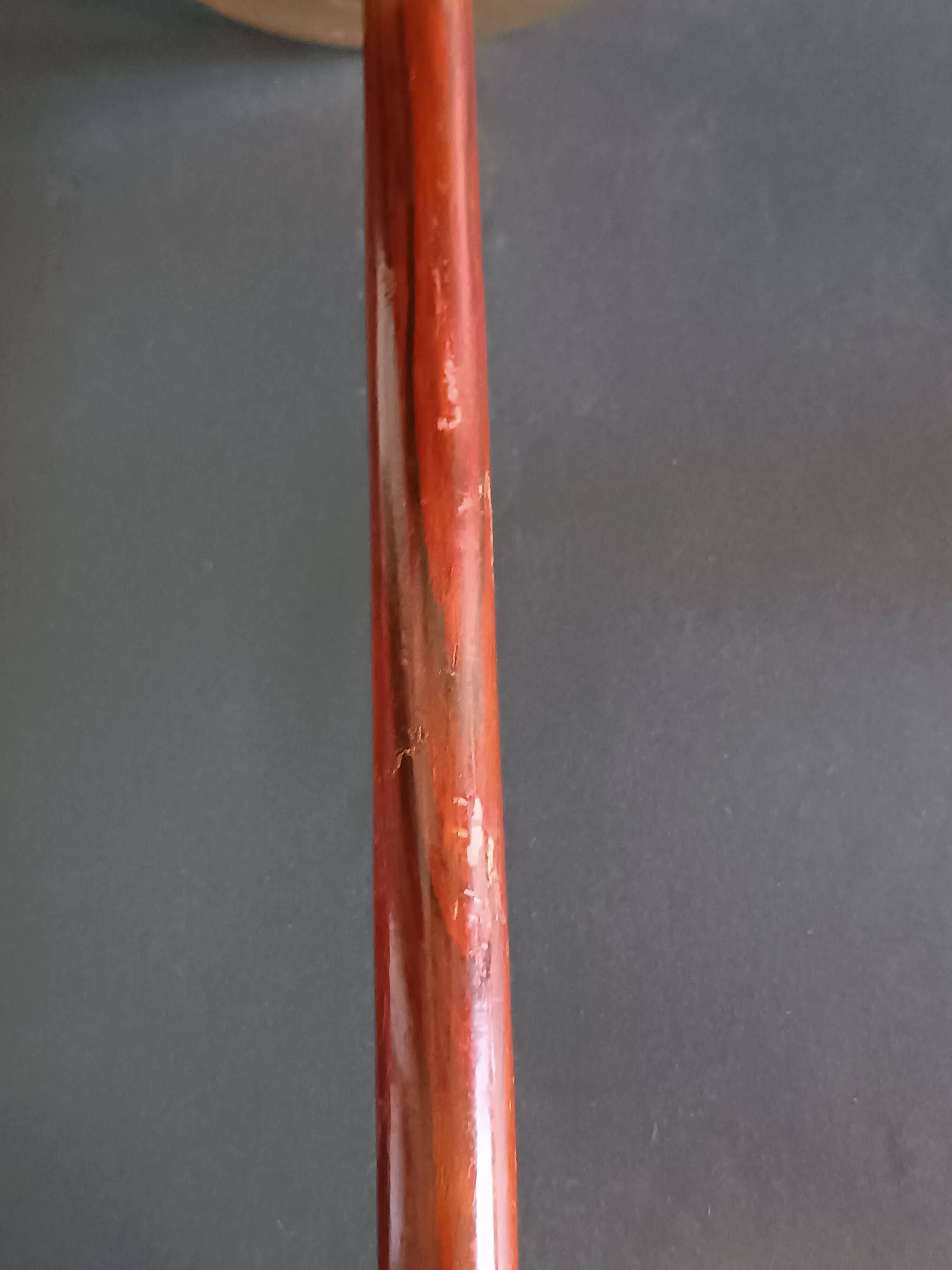 Two vintage wooden and brass candlesticks.