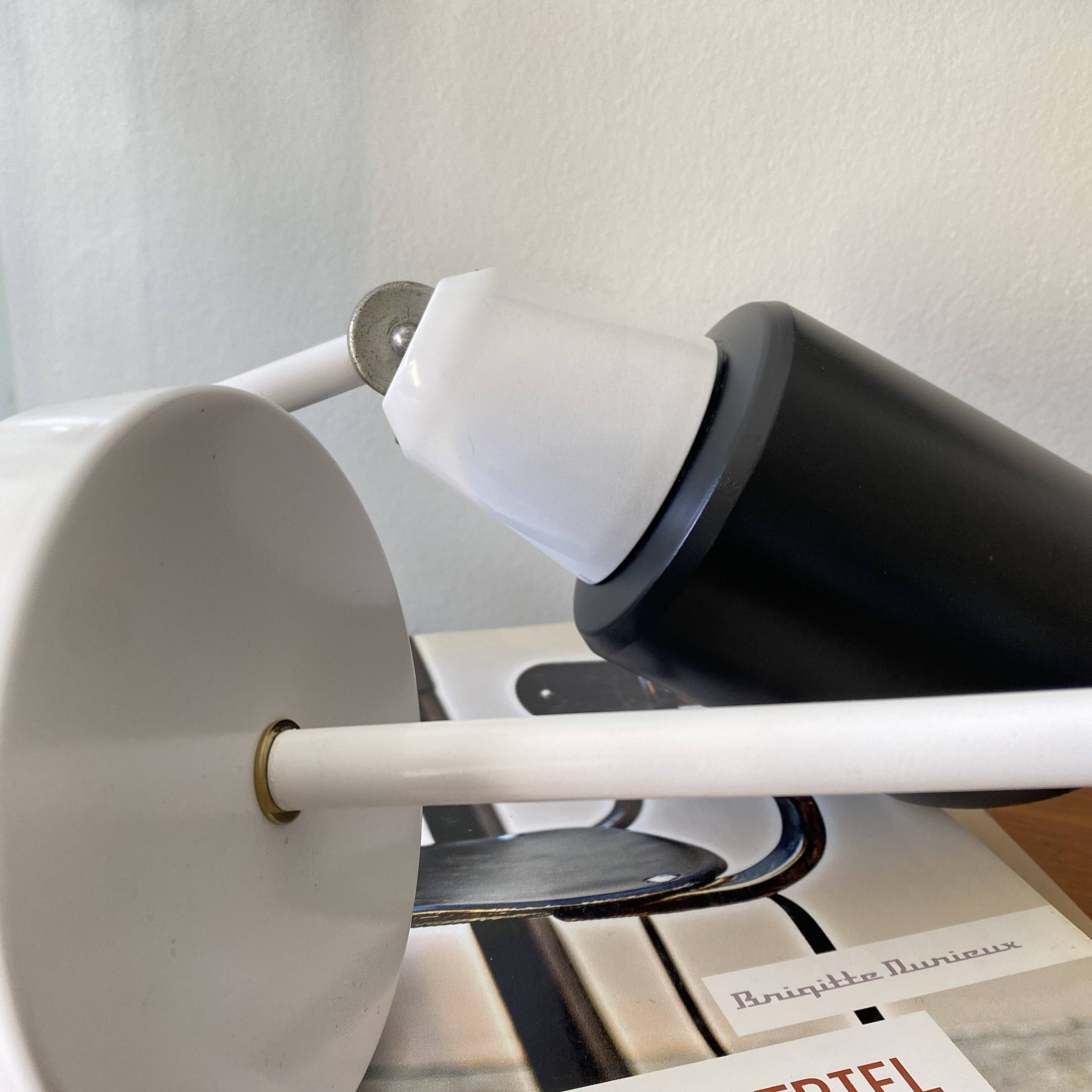 Pair of adjustable industrial metal wall sconces.