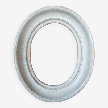 Oval frame patinated plaster