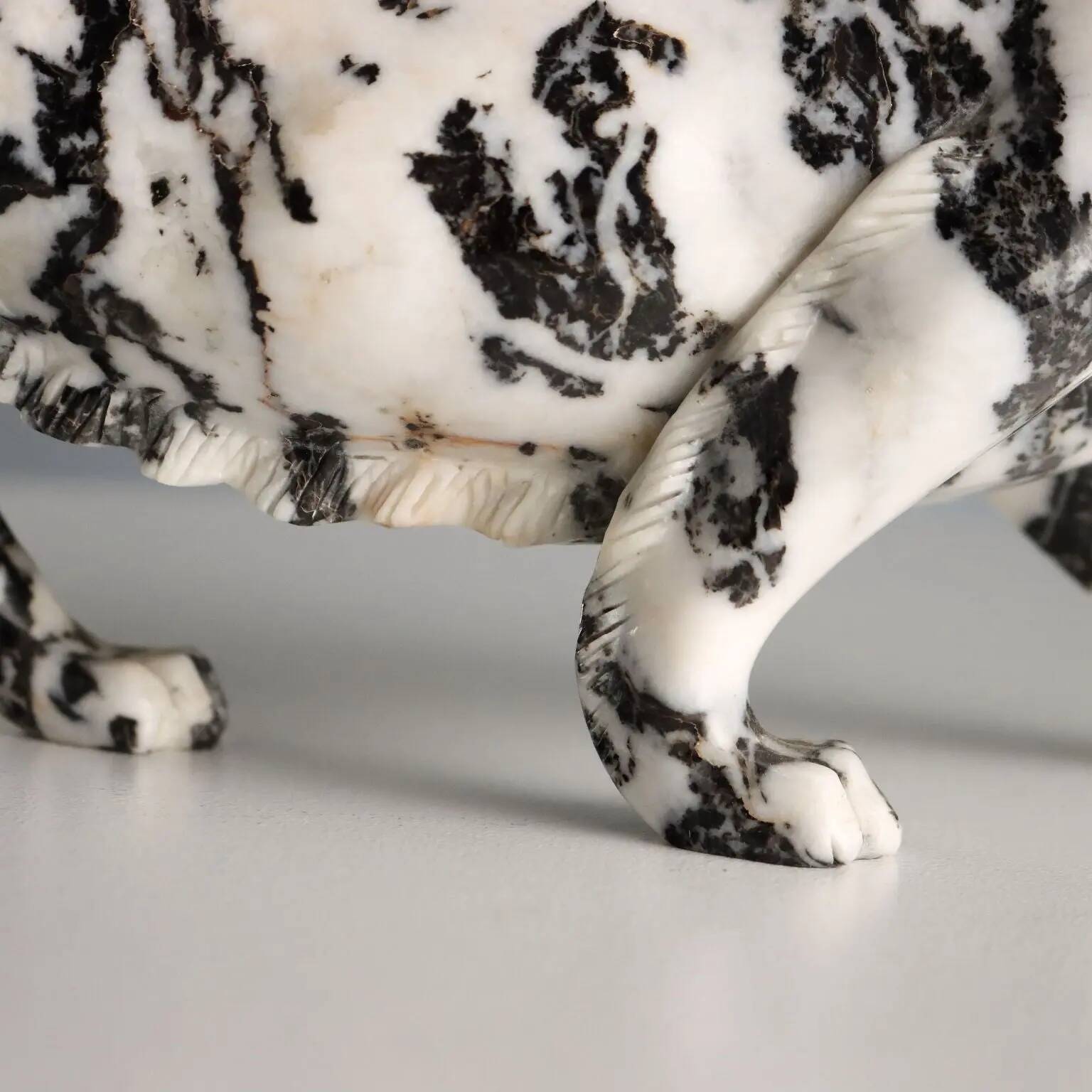 Ancient sculpture of a black and white marble panther, 20th century.