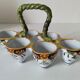 Antique egg holder by Jules Verlingue with polychrome floral decoration.