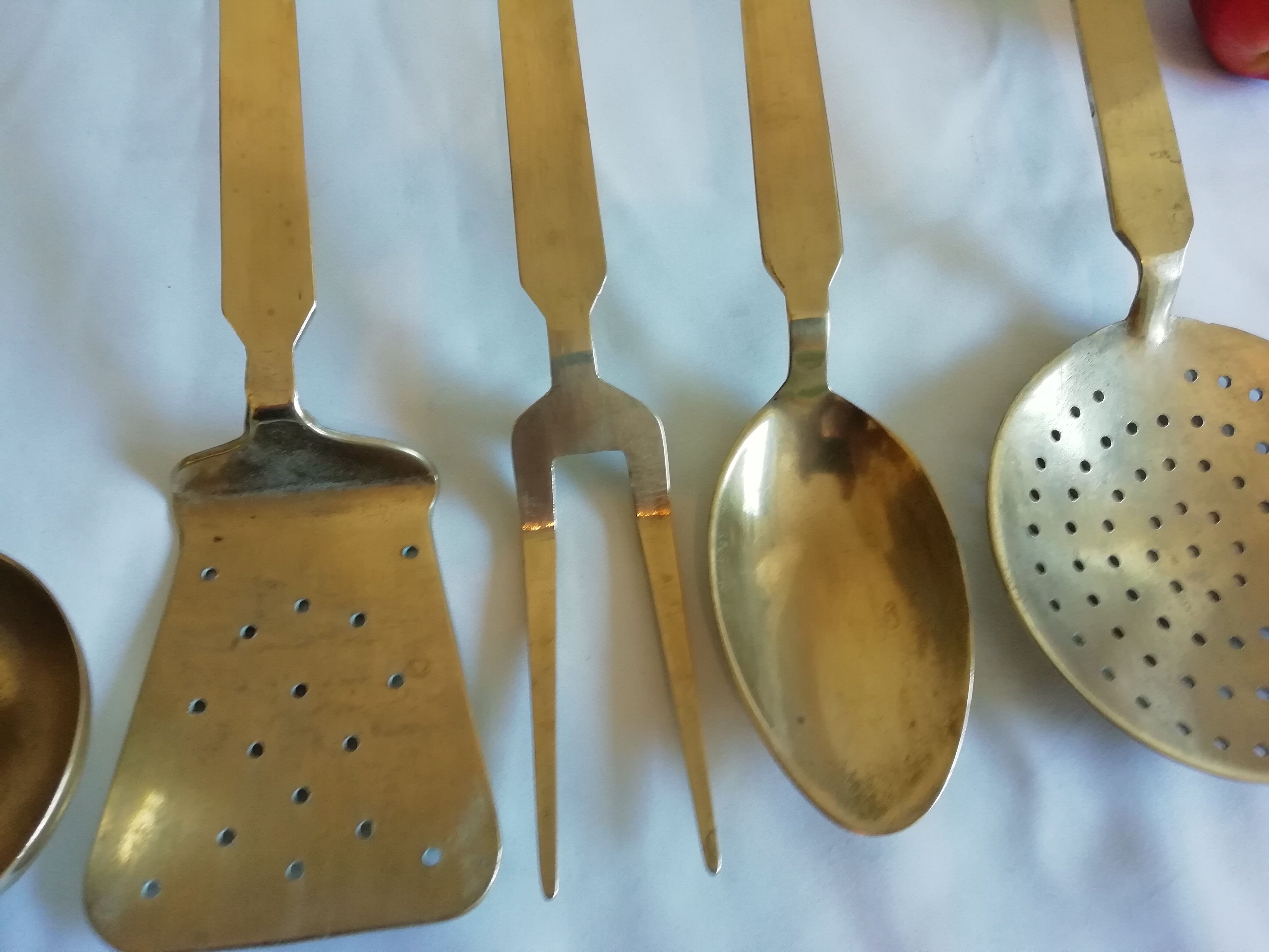 Set of brass kitchen utensils. Early XXeme