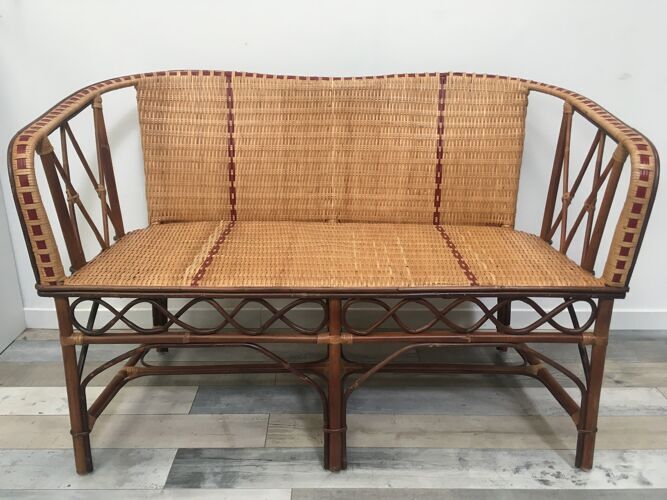Braided rattan sofa and red edging