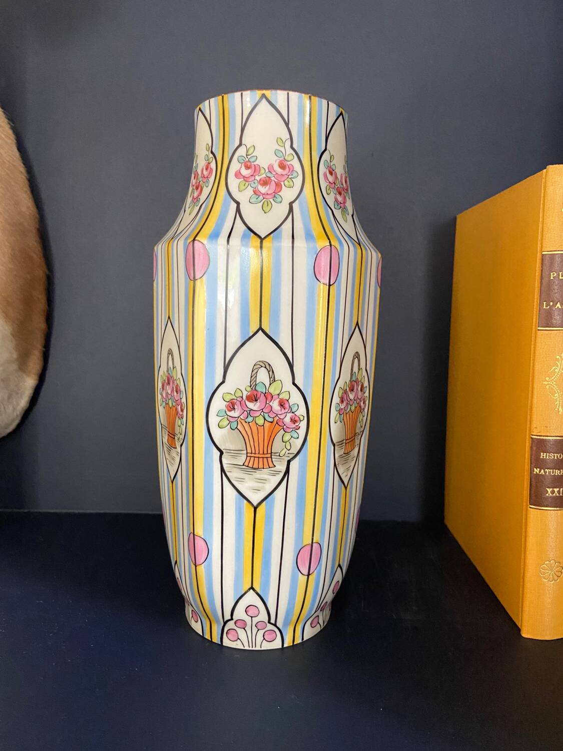 Striped ceramic vase with flowers