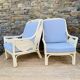 Pair of white rattan armchairs