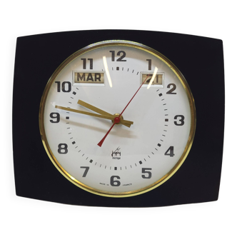 Horloge murale vintage japy en formica avec le jour et la date calendrier