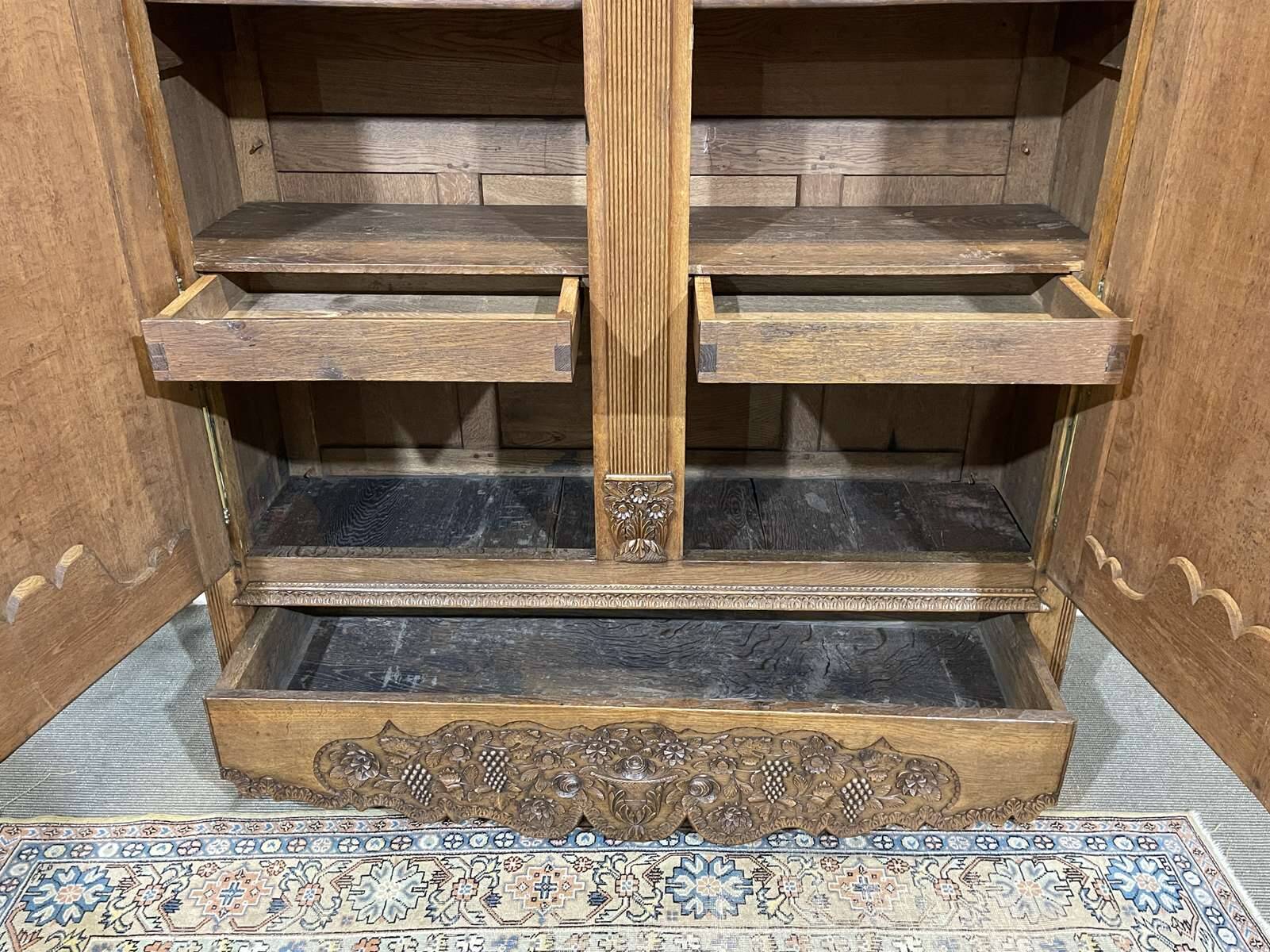 19th-century Norman wedding armoire in blonde oak.