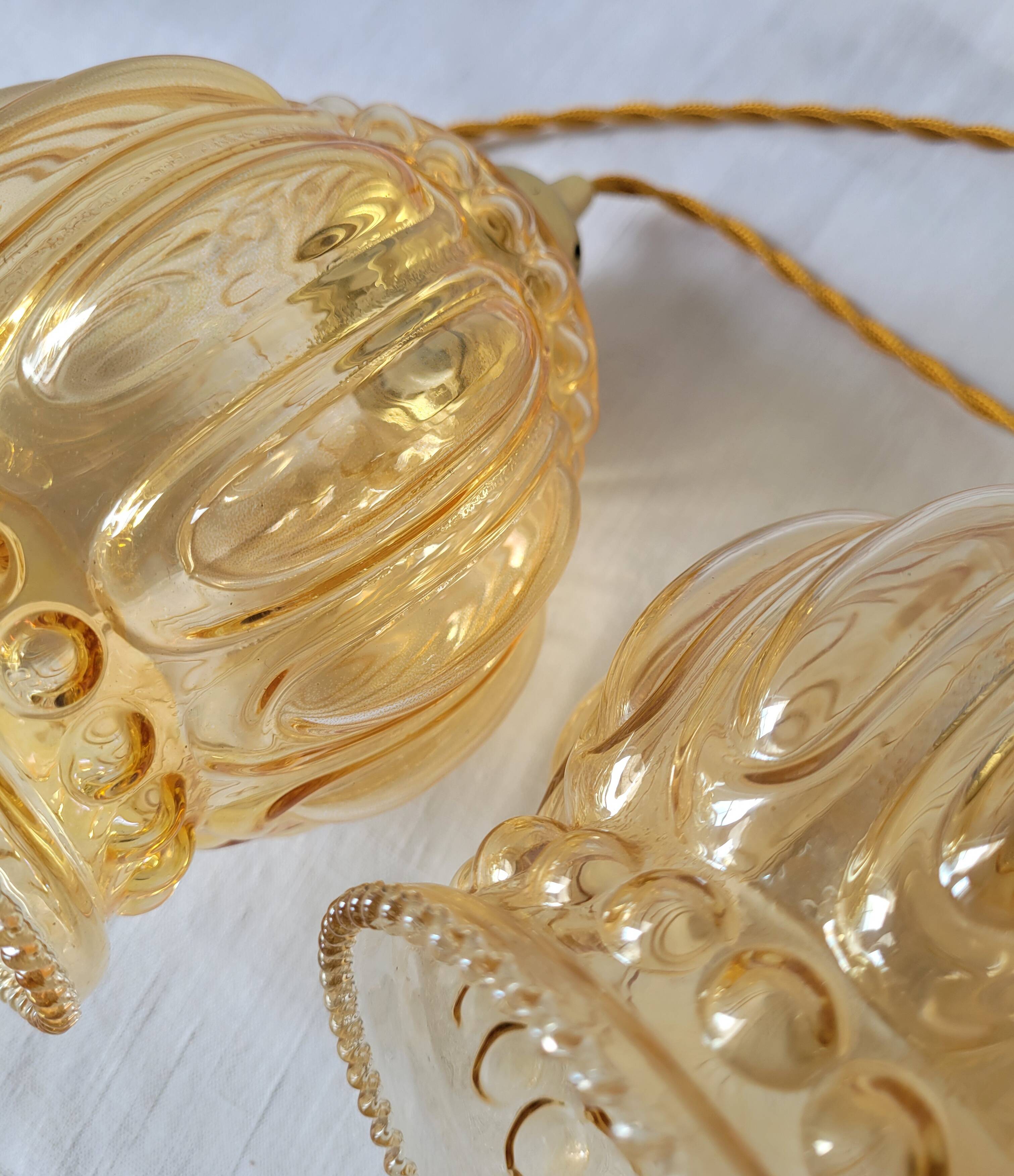 Duo of amber molded glass pendant lights