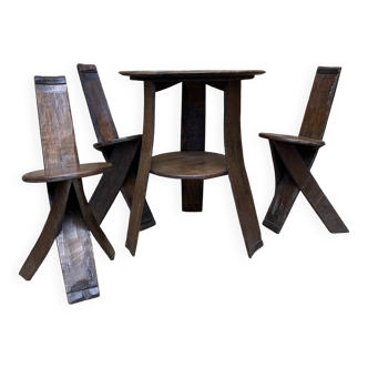 Brutalist style table and chairs, wine cellar.